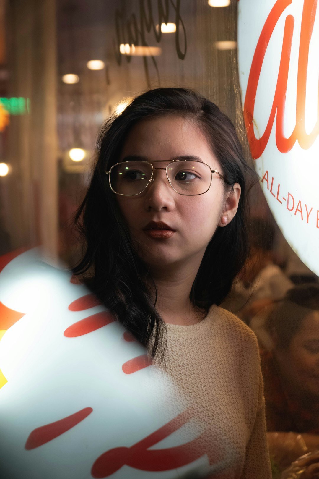 Portrait of a young woman with glasses